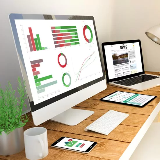 Office desk with computer screen showing data